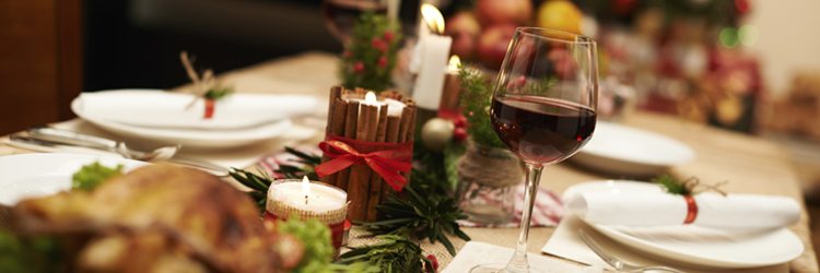 Traditionally Christmas table with candles and juniper